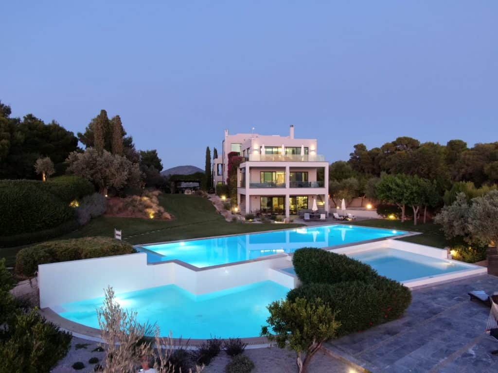 Villa Magnolia and its pools, at sunset. Plan your trip