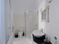 Villa Dulcinea in Santorini Greece, bathroom, by Olive Villa Rentals