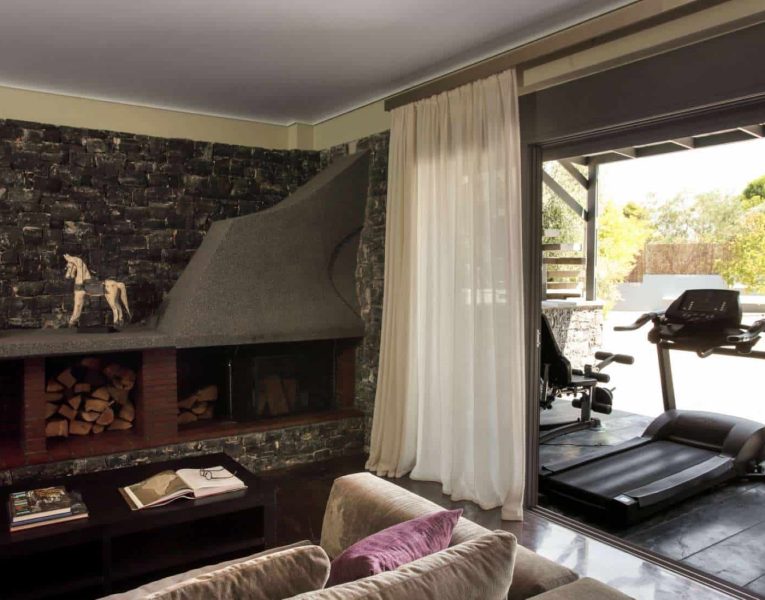 Villa-Copper-Evia-by-Olive-Villa-Rentals-seperate-space-living-room
