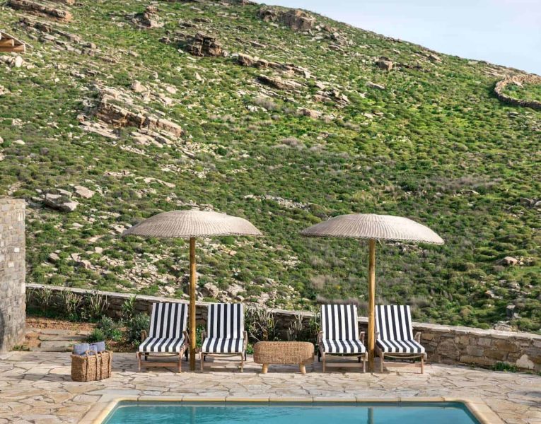 Villa- Cinqo-Paros-by-Olive-Villa-Rentals-exterior-pool-area-sunbeds